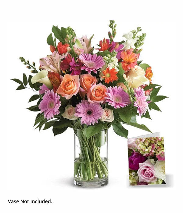 Florist's Choice II bouquet with roses, daisies, and flowers in a vase.
