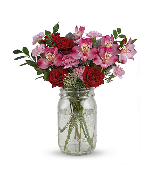 Romance rose dans un bocal en verre