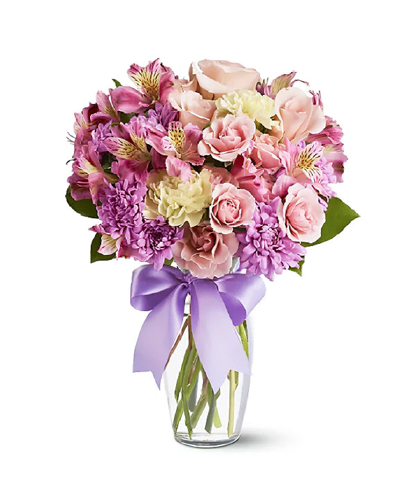 Splendid Spring bouquet of pink and purple flowers in a vase.